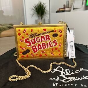 Brand new Rare Alice and Olivia beaded clutch in gold